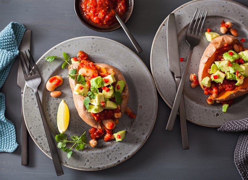 Chili and avocado stuffed sweet potatoes