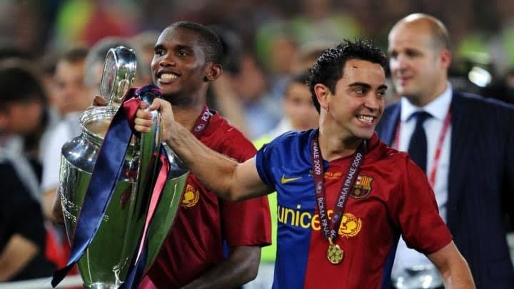 Eto'o and Xavi celebrate winning the 2005 UCL title with Barcelona.