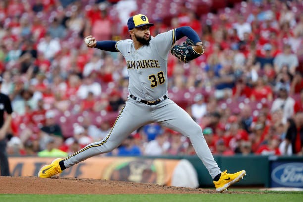 Devin Williams of the Milwaukee Brewers throws a pitch during the ninth inning of the game against the Cincinnati Reds at Great American Ball Park on...