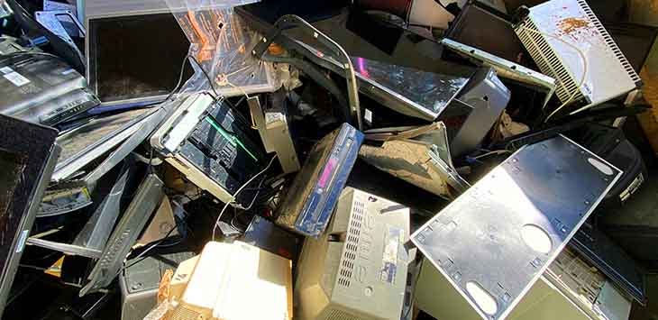 Photo of IT kit in a rubbish heap.