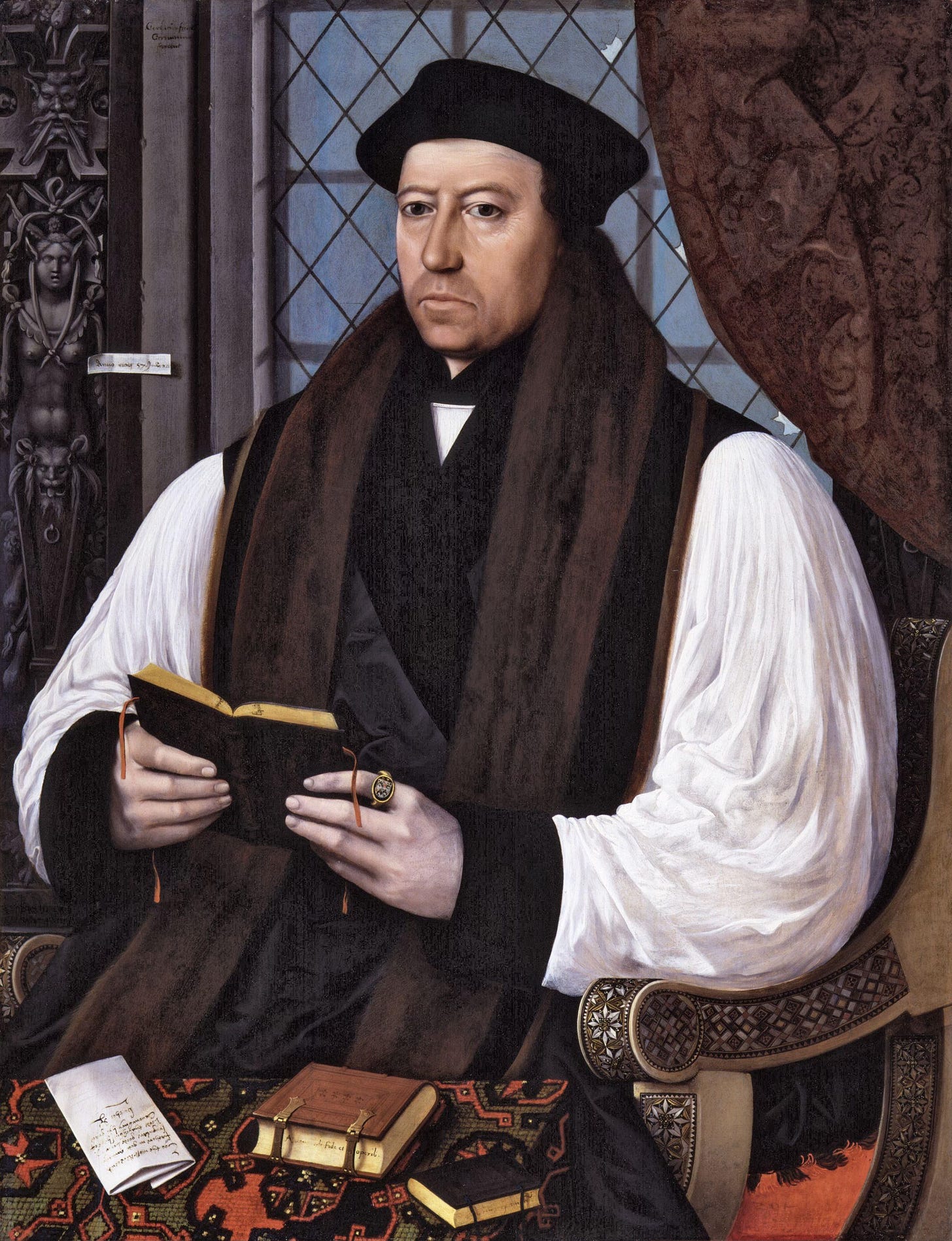 In the portrait above, Thomas Cranmer holds the Epistles of St Paul, while resting on his desk are two books, including Augustine’s Of Faith and Works.