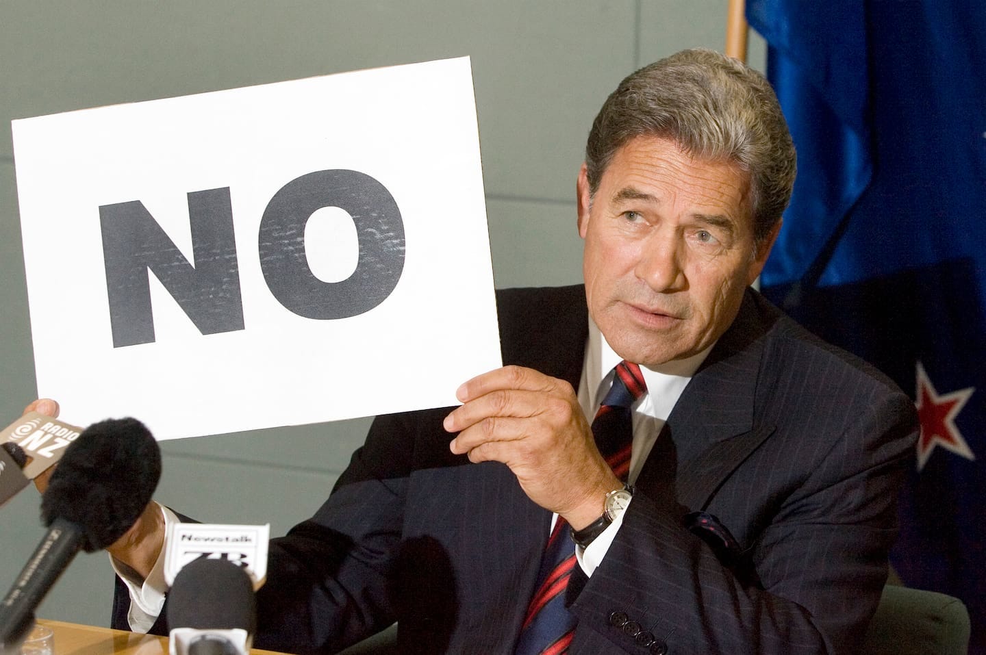 Foreign Minister Winston Peters during a media conference at Parliament, where he denied Owen Glenn has given money to New Zealand First. Peters is holding a sign saying No. Photo / Mark Mitchell