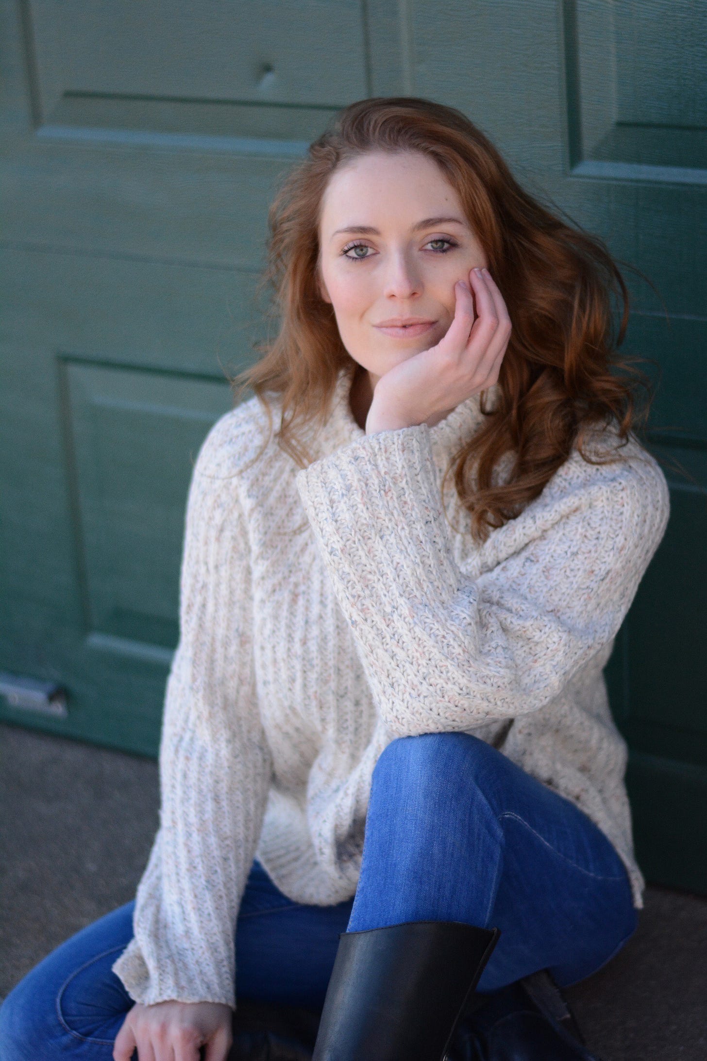 Author photo of the beautiful Jen Waite in a cream sweater against a dark teal door
