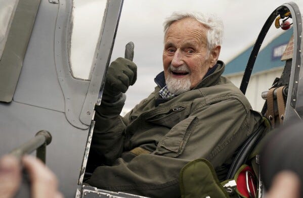 102-year-old Jack Hemmings AFC gestures after flying a Spitfire plane to mark 80th anniversary of the military charity Mission Aviation Fellowship (MAF) at Heritage Hanger at London Biggin Hill, England, Monday, Feb. 5, 2024. Hemmings took to the skies in Britain's best-loved Second World War aircraft to raise money for MAF, the charity he co-founded almost 80 years ago. (Gareth Fuller/PA via AP)