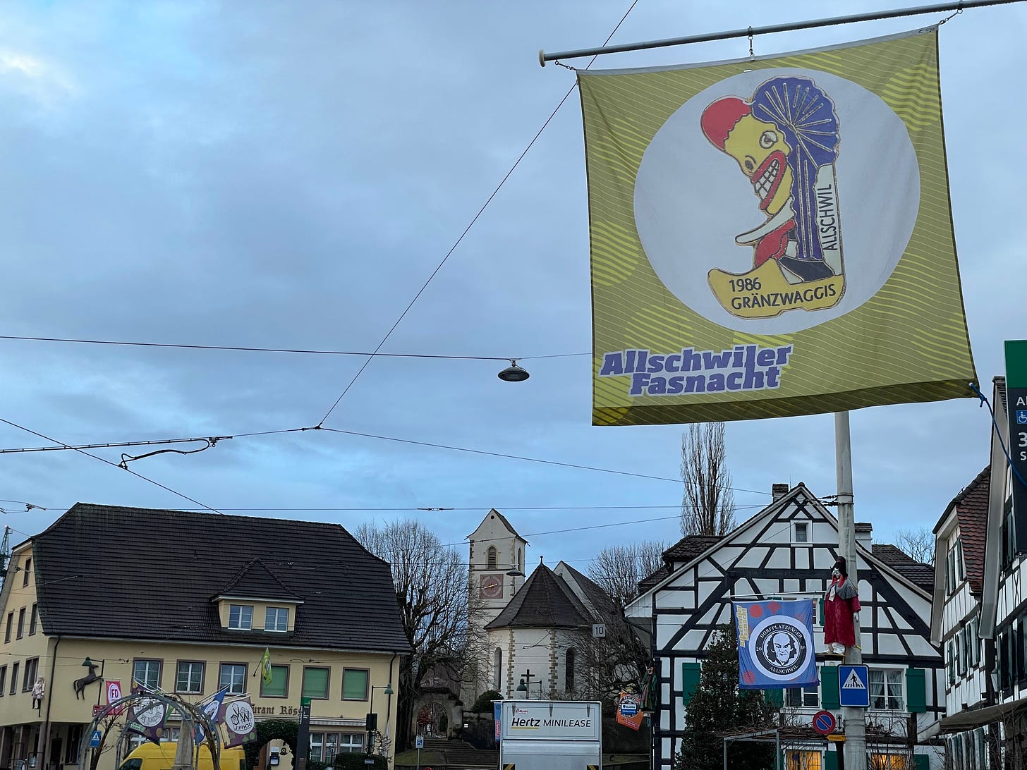 Allschwiler Fasnacht flag showing a Waggis in a clog with the words "1986 Gränzwaggis"