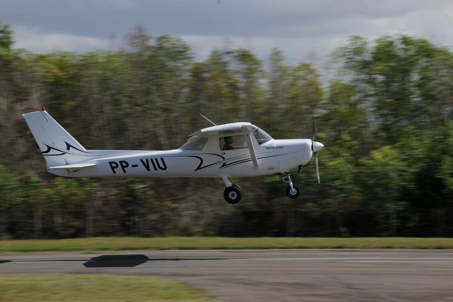 2-seater plane taking off from country road 2-seater plane taking off from country road
