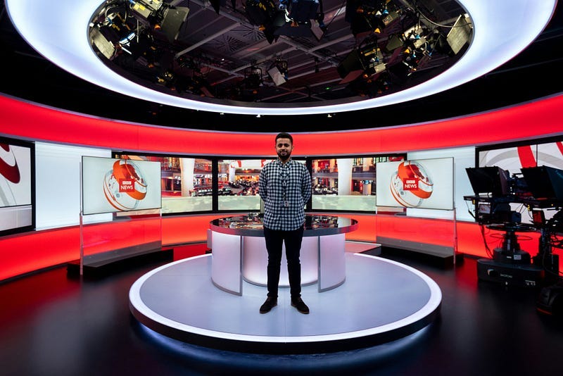 News presenter in studio News presenter in studio