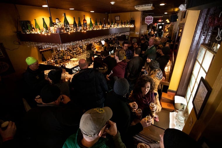 People filling the bar during "Pliny the Younger Day" at Monk's Cafe on Feb. 17, 2020.