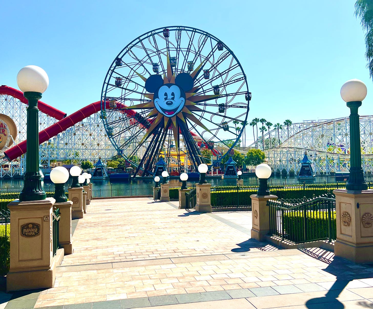 Disney's Pixar Pier Ferris Wheel with the Incredicoaster in the background