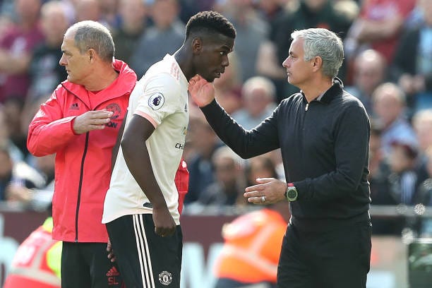Man Utd manager Jose Mourinho pats Paul Pogba of Man Utd on the back as he is subbed off during the Premier League match between West Ham United and...