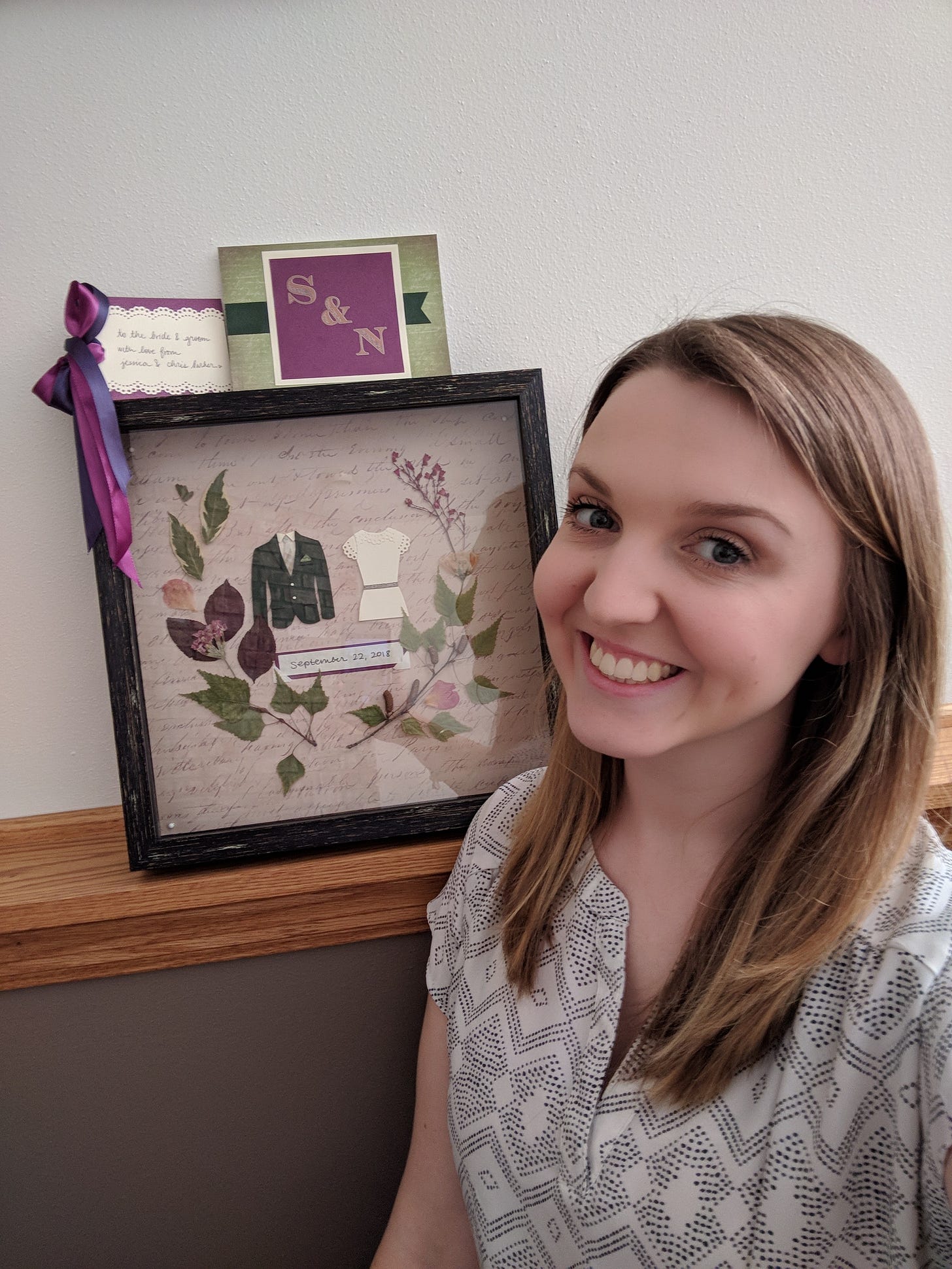 Jessica smiling in front of the handmade gift, card, and tag