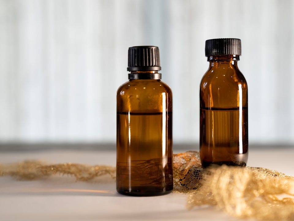 a couple of brown bottles sitting on top of a table