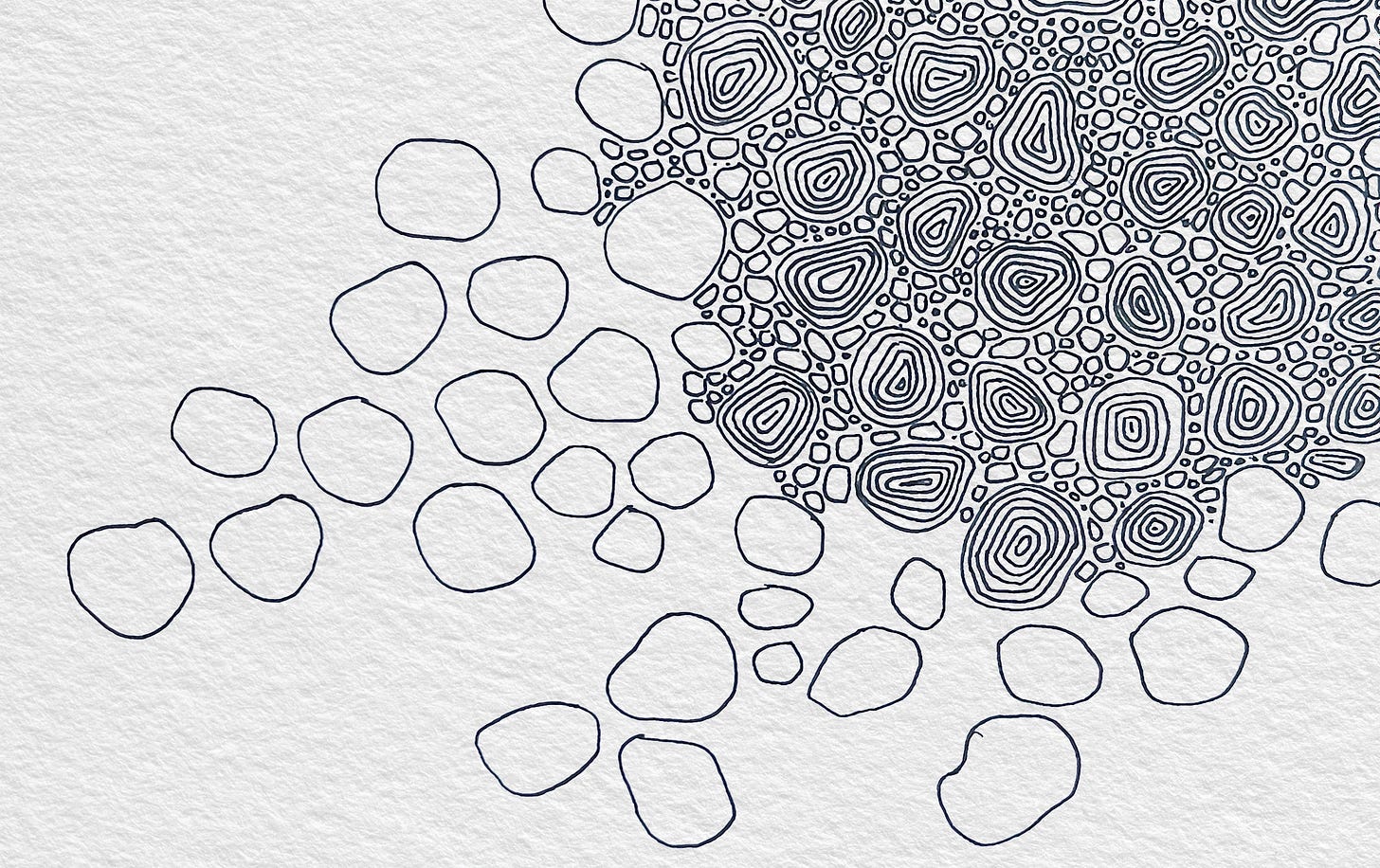Pattern of cobble stones drawn on textured white paper