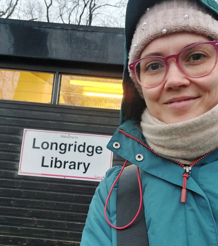 A selfie of me in my rain coat outside Longridge Library