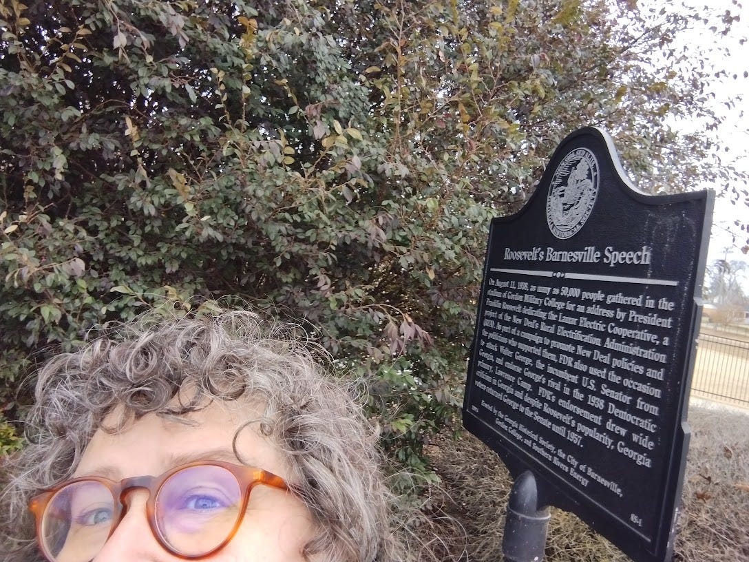 Woman with historical plaque