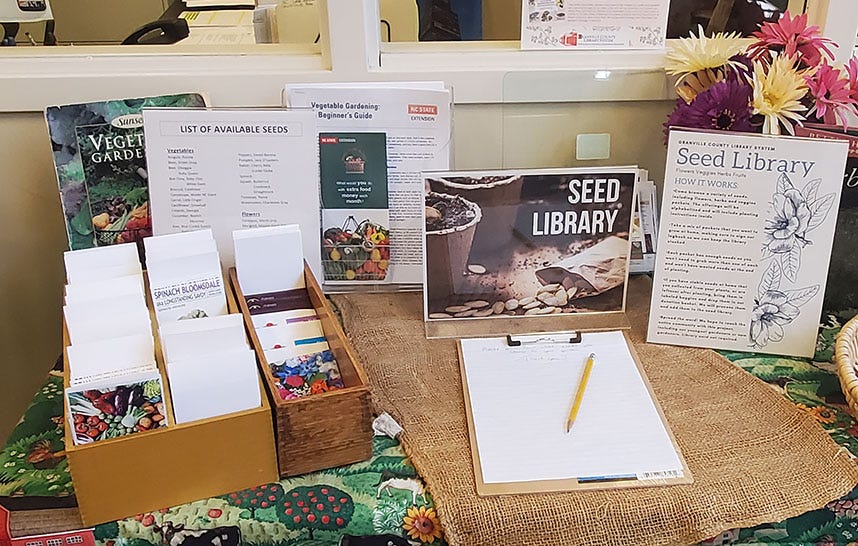 Seed library set up at the South Branch Library. Consists of a small display about local seeds including plant information and seed packets. 