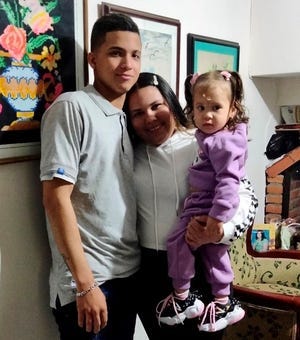 Jimmy Barboza, Mariangel Gonzalez and Jismary, 3, of Venezuela, boarded a Texas-sponsored bus from Brownsville to Chicago last month after being allowed into the U.S. to seek asylum. Jismary had a low-grade fever and other symptoms as she boarded the bus and later died en route, a new report says, raising questions as to the medical screening process on the state-sponsored bus trips.