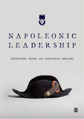 Napoleon's hat on a grey background with title of book in blue
