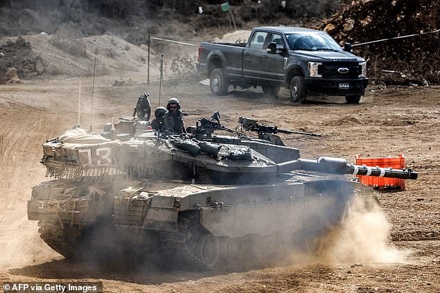 An Israeli army main battle tank moves at a position along the border with Lebanon in northern Israel on October 1, 2024