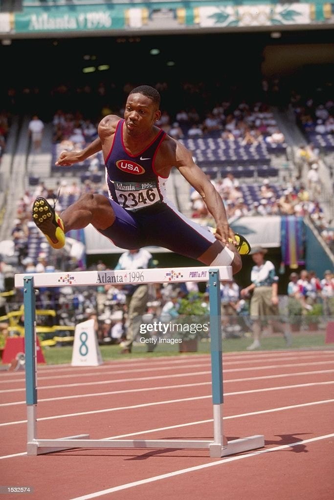 Calvin Davis of the USA in full stride competes in the heats of the ...