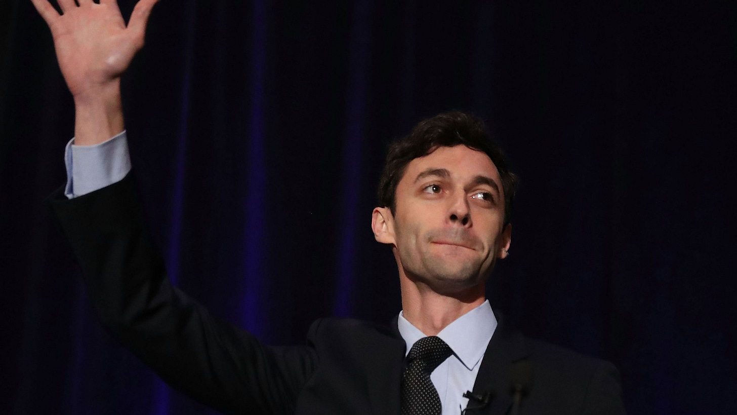 Georgia Democrat Jon Osoff waves at supporters Georgia Democrat Jon Osoff waves at supporters