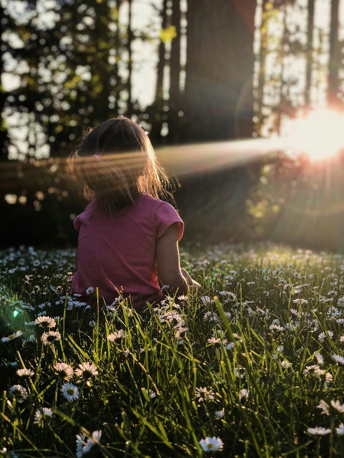 Child looking at sunshine