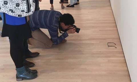 Glasses (spectacles) placed on the floor in an art gallery at SFMONA as a prank by TJ Khayatan and his friend to see how people would react.