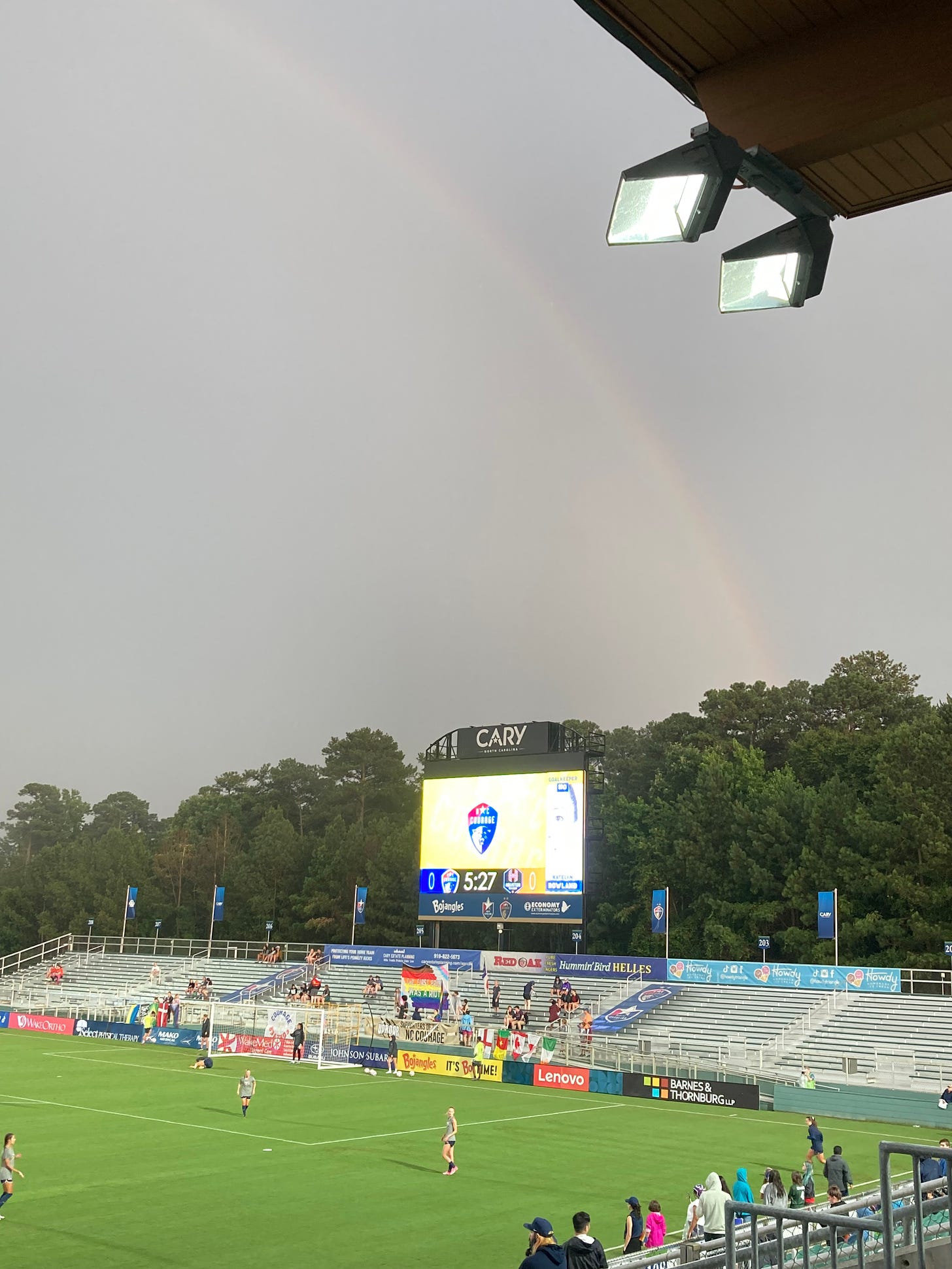 A faint rainbow appears over WakeMed Soccer Park