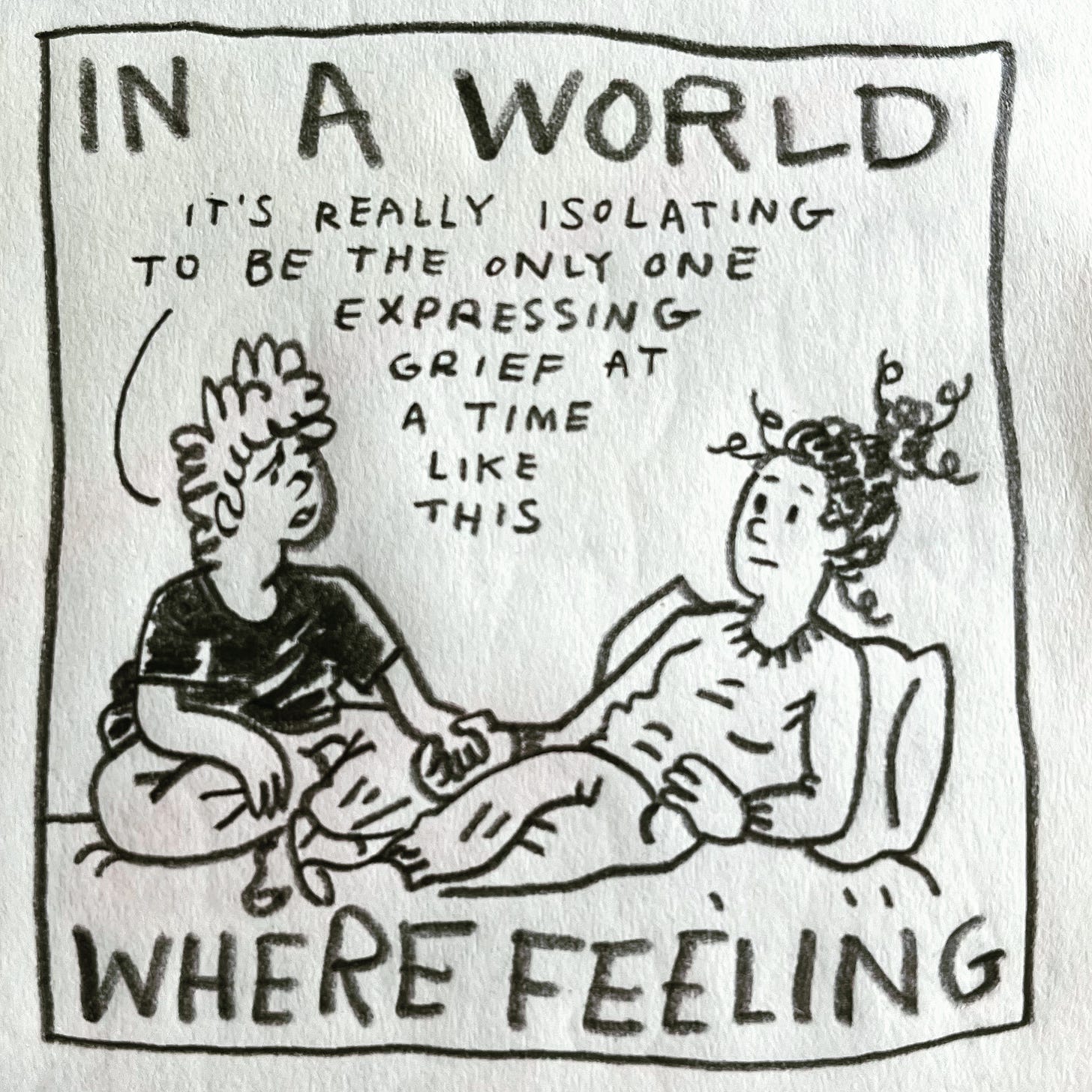 Panel 2: in a world where feeling Image: Lark sits cross-legged on a bed, holding hands with their sister, who is wearing a sweater, sweatpants and socks, leaning against a pillow against the wall. Lark is wearing a black T-shirt, sweatpants and socks. They frown, saying "it's really isolating to be the only one expressing grief at a time like this"