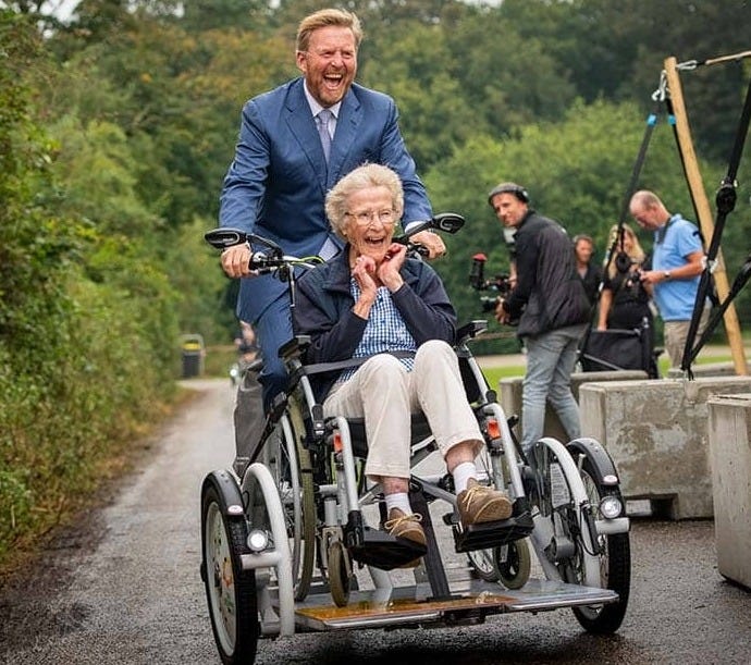 Dutch King Willem-Alexander shines on Van Raam wheelchair bike VeloPlus at Zonnebloem jubilee