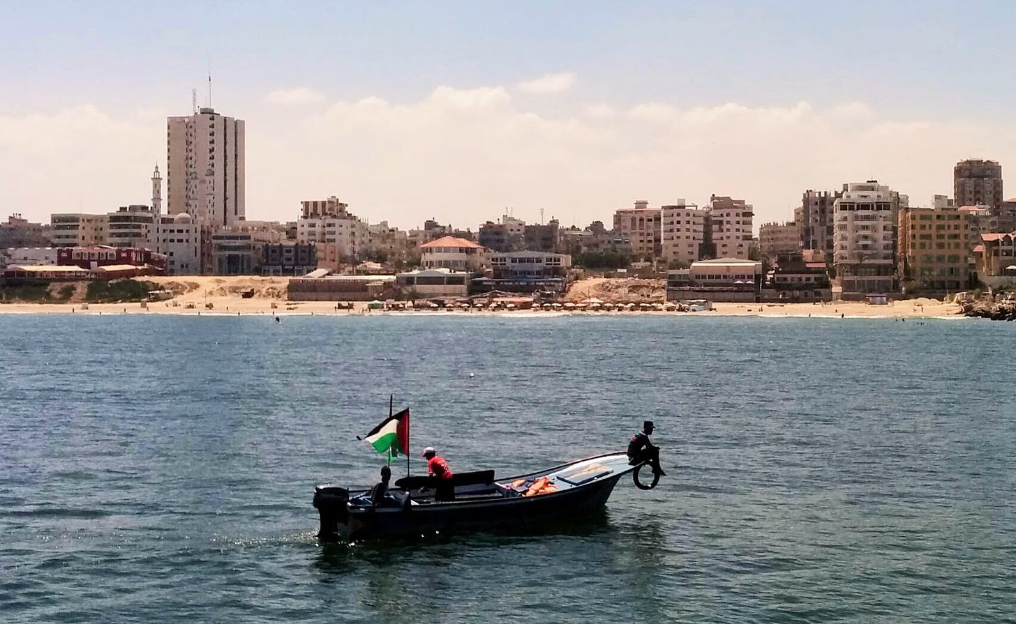 Men on a fishing boat in the harbor of Gaza City