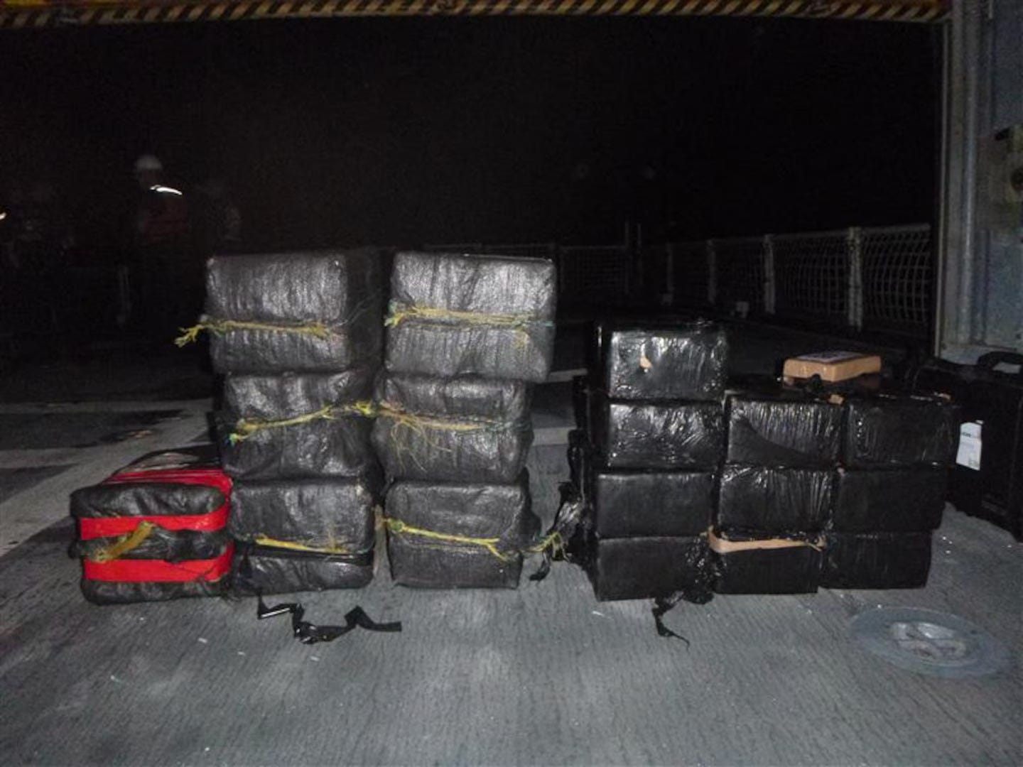 Bales of drugs on the deck of the US Coast Guard Cutter "Mohawk" following the interdiction of a cartel drug smuggler at sea. Bales of drugs on the deck of the US Coast Guard Cutter "Mohawk" following the interdiction of a cartel drug smuggler at sea.