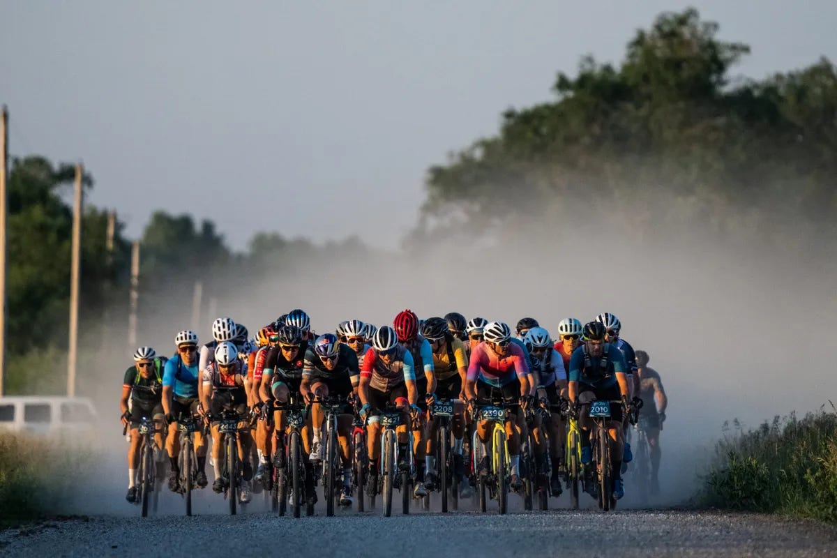 Unbound Gravel Race, view of cyclist in action, starting pack during race.