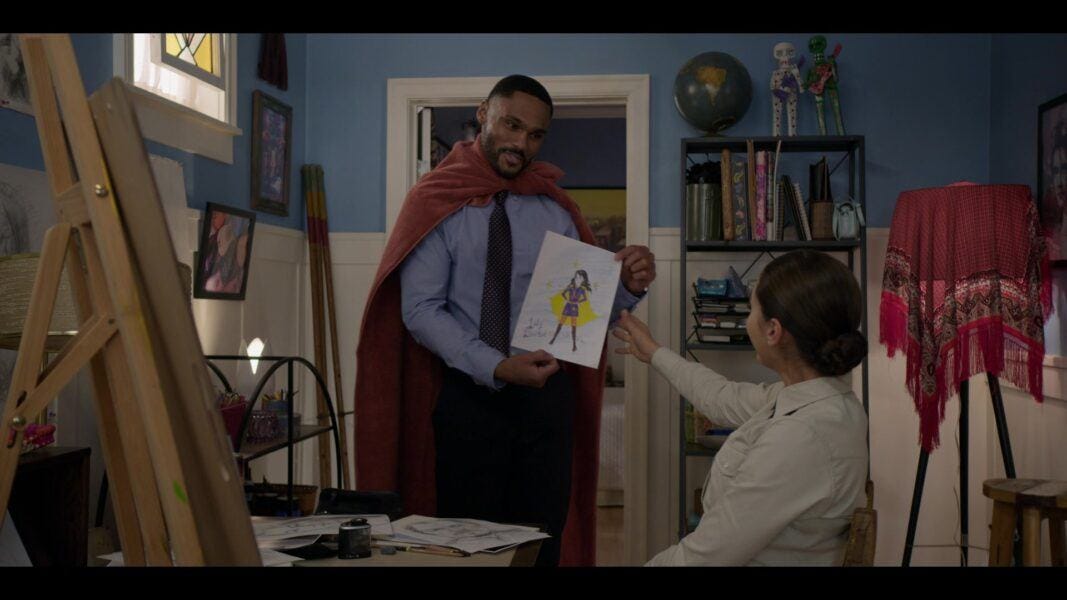 Walker Tred in cape giving Mickey art of superhero