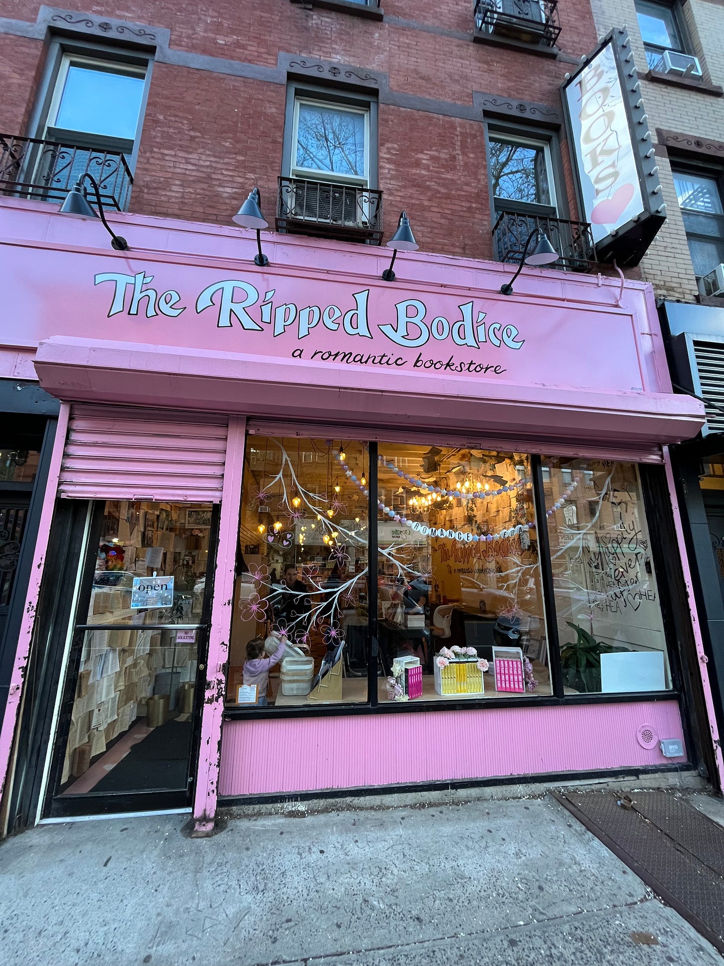 A picture of the pink outside of The Ripped Bodice in Brooklyn