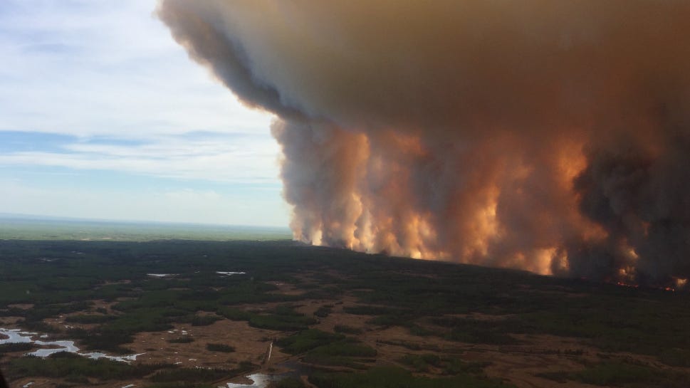 Wall of smoke high in sky, Chuckegg Creek fire, Alberta
