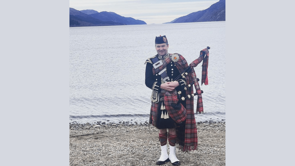 Spud the Piper Plays Cronin at Loch Morlich.