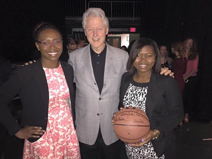 Towson University students Oumou Diallo and Jacqueline Bell pose with former President Bill Clinton after winning the CGI U Commitment Challenge. 