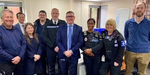 CI Paul Ballard, Council Chief Executive Doug Wilkinson and colleagues from the PFCC, council and community policing team.