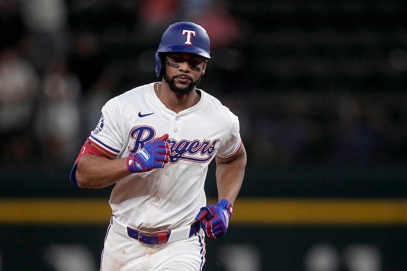 Texas Rangers' Leody Taveras rounds the bases after hitting a two-run home run against the...