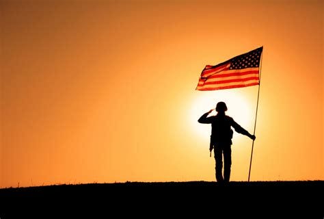 USA Soldier with flag saluting on sunset horizon - WINDFM - 92.5 ...