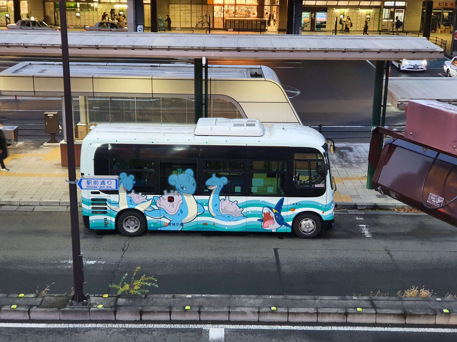 A coach displaying Three Lapras and a Sharpedo, offering rides around Sendai