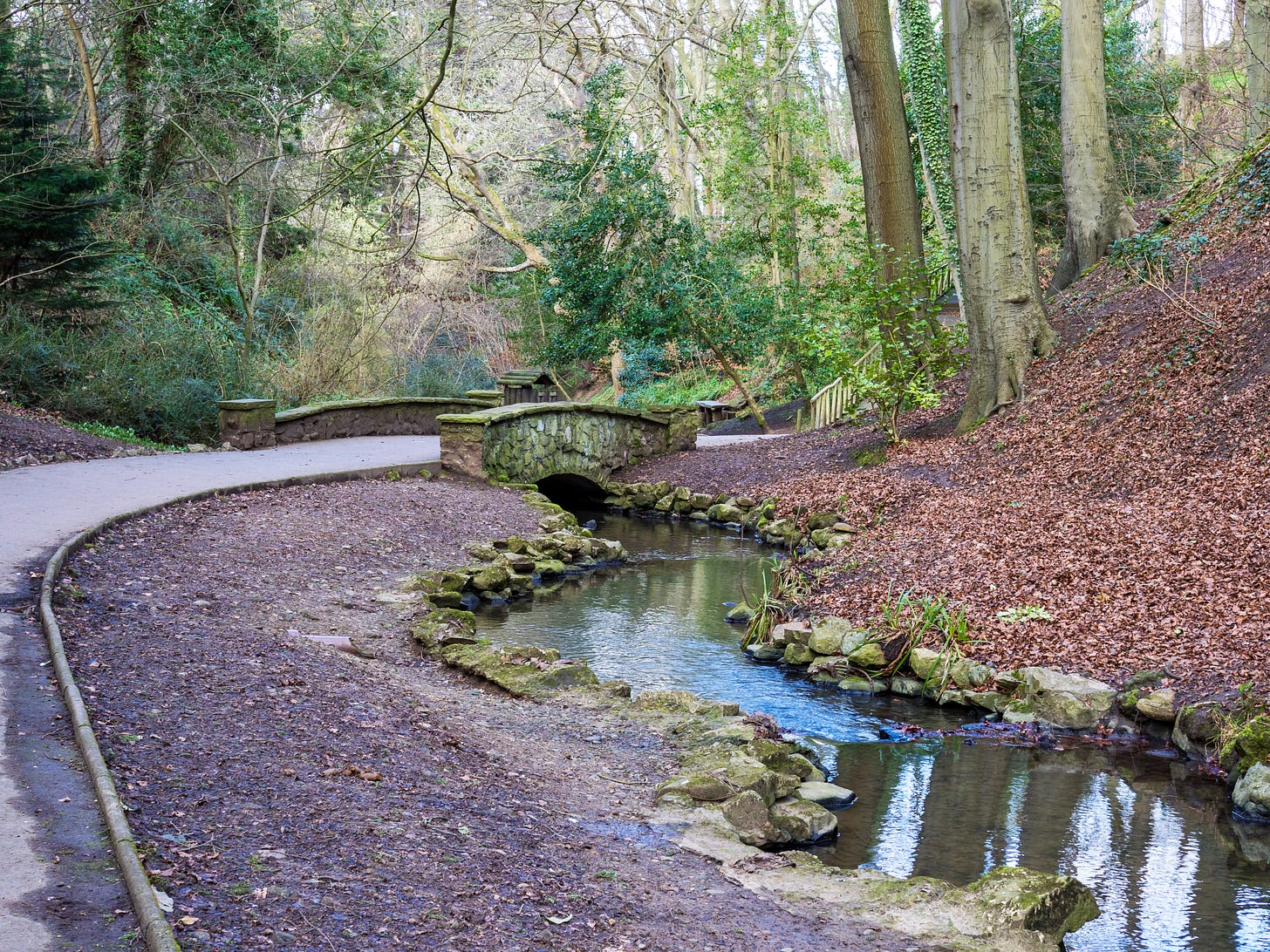 A path beside a stream in Peasholm Glen in Scarborough, North Yorkshire, England