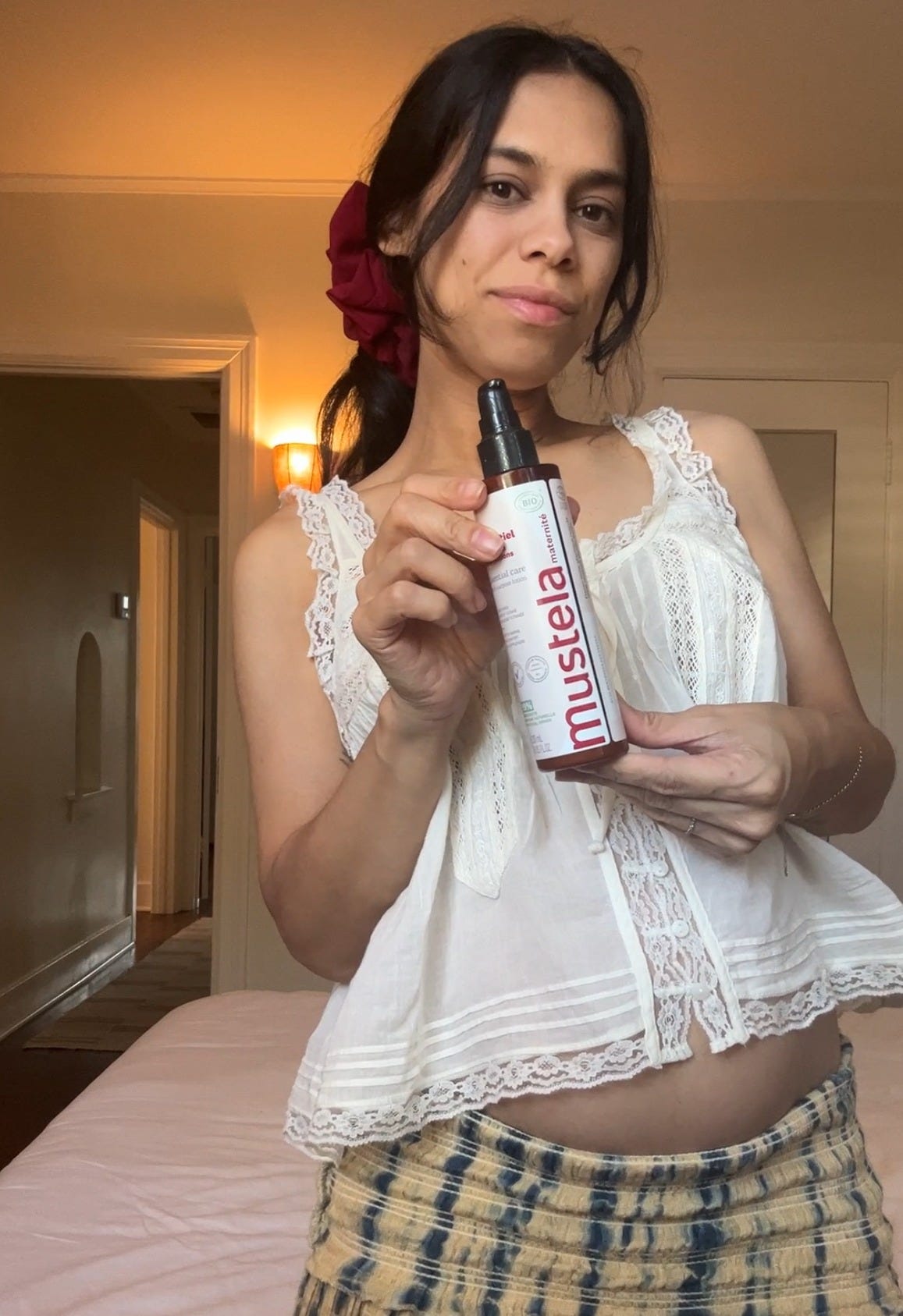 Shanna Shipin holding a Mustela product she used when pregnant