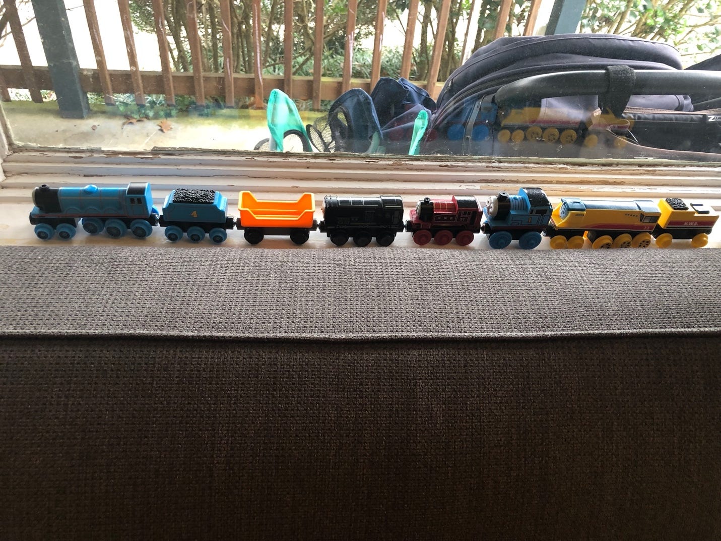 A toy train on a couch

Description automatically generated