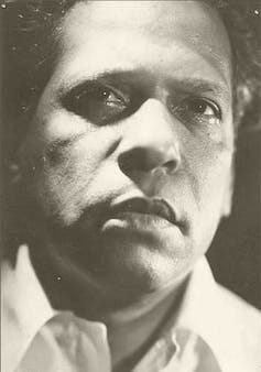 Close up sepia photograph of Nicolás Guillén's face.