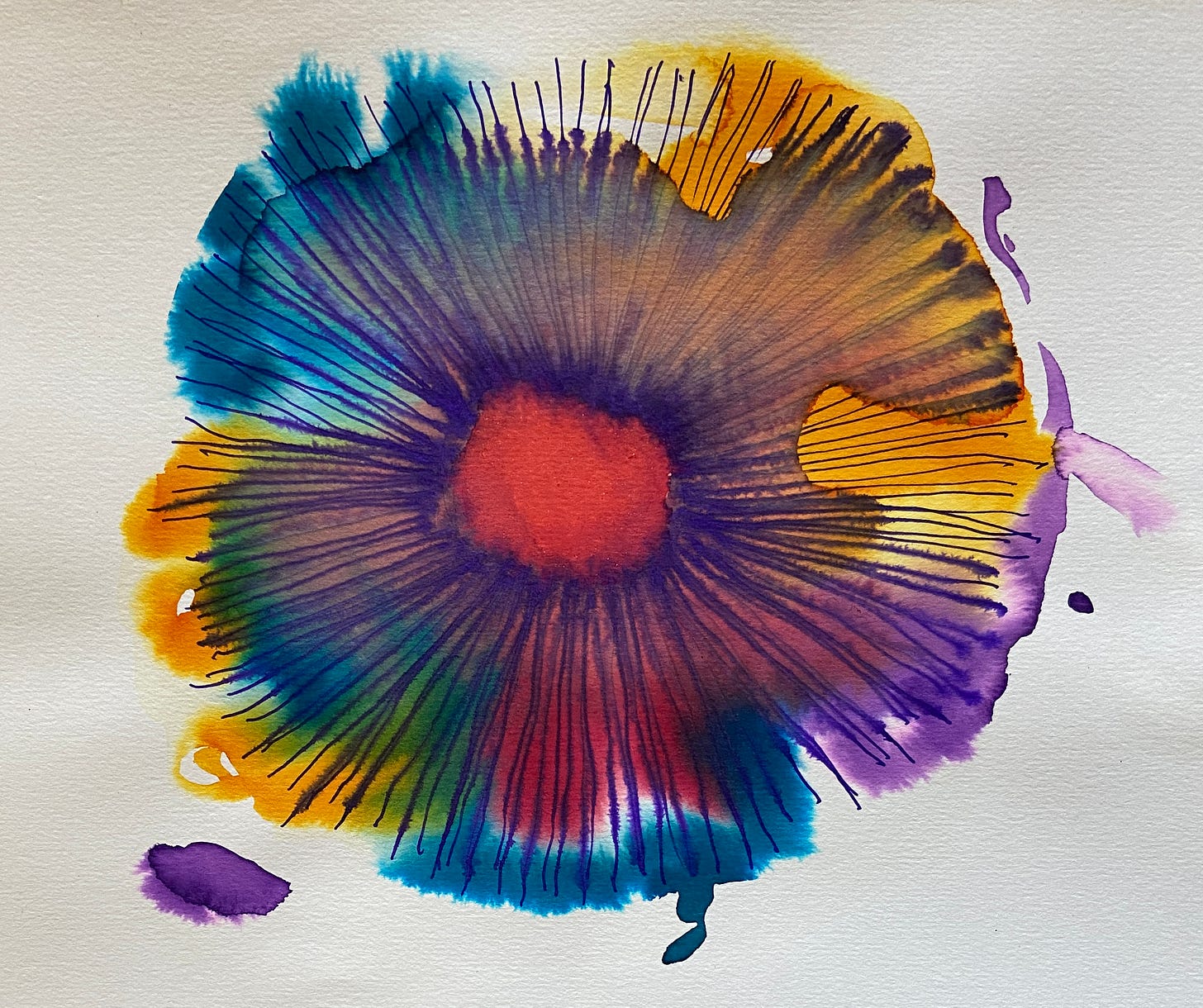 flower shaped in blue, red, yellow and purple paint