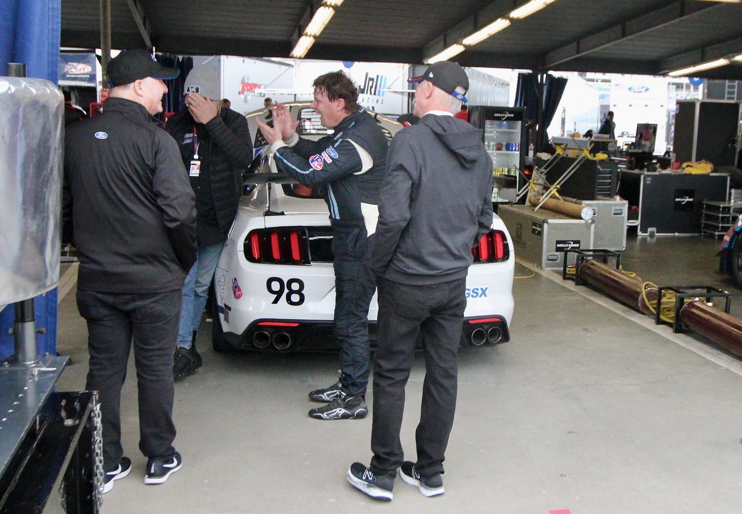 Ford CEO Jim Farley discussing his first race just after climbing out of his No. 98 Mustang GT4.