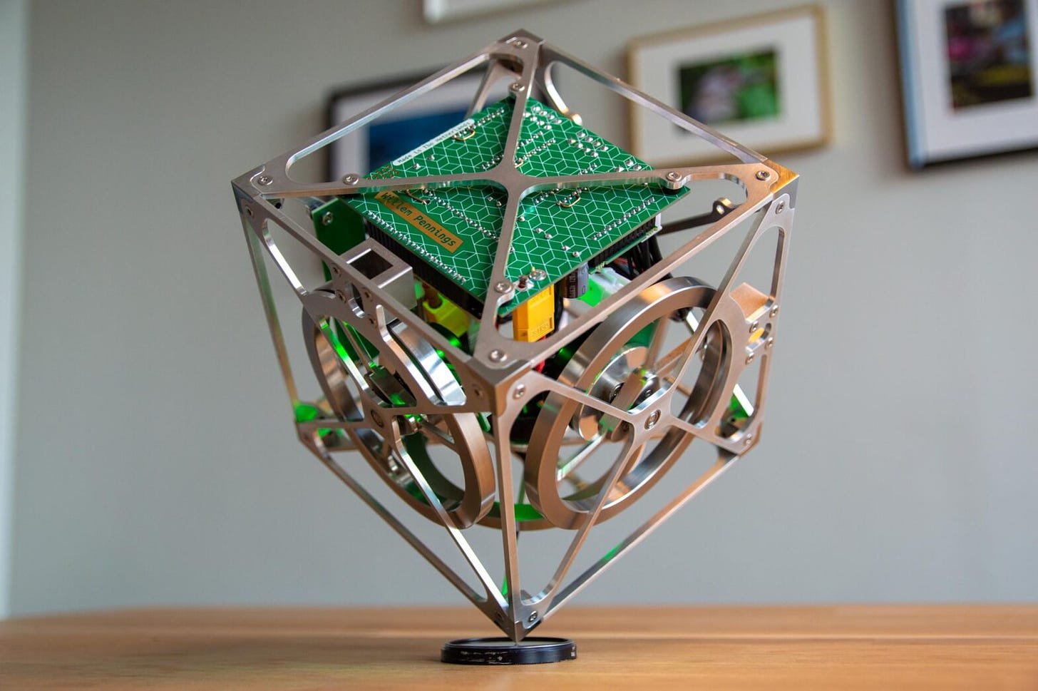 This cube can balance on its corner using three orthogonally mounted reaction wheels