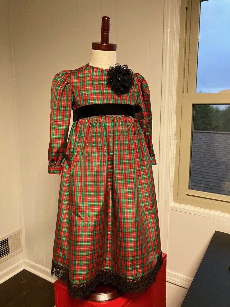 The fabric and the pattern were both given to me, so all I had to buy was buttons and trim!